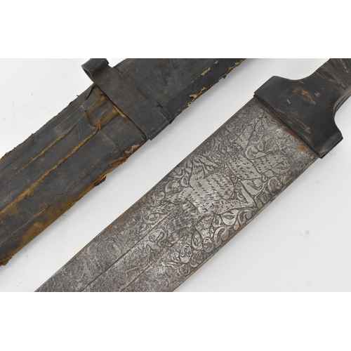 33 - A 19th century Sudanese / North African sword (kaskara type), the broad double-edged steel blade etc... 