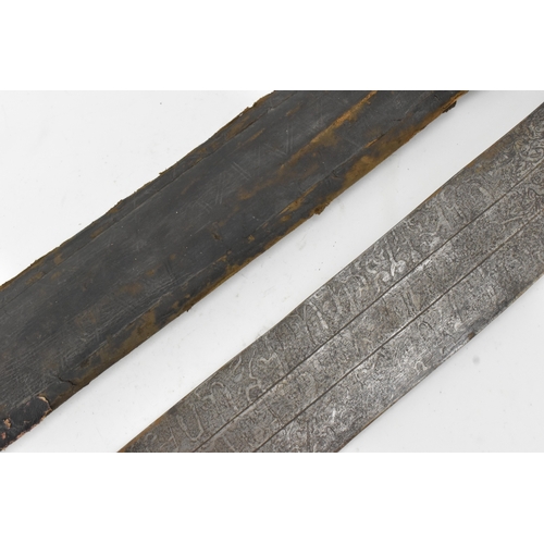 33 - A 19th century Sudanese / North African sword (kaskara type), the broad double-edged steel blade etc... 