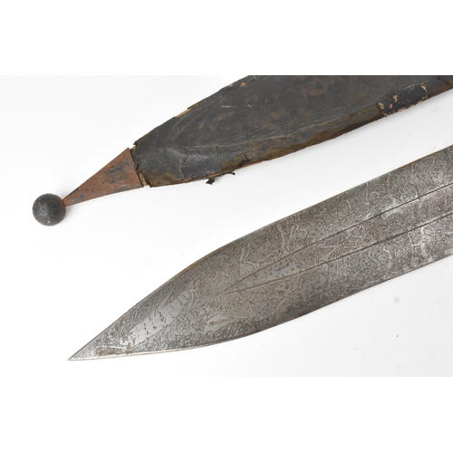 33 - A 19th century Sudanese / North African sword (kaskara type), the broad double-edged steel blade etc... 