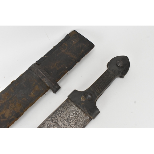 33 - A 19th century Sudanese / North African sword (kaskara type), the broad double-edged steel blade etc... 