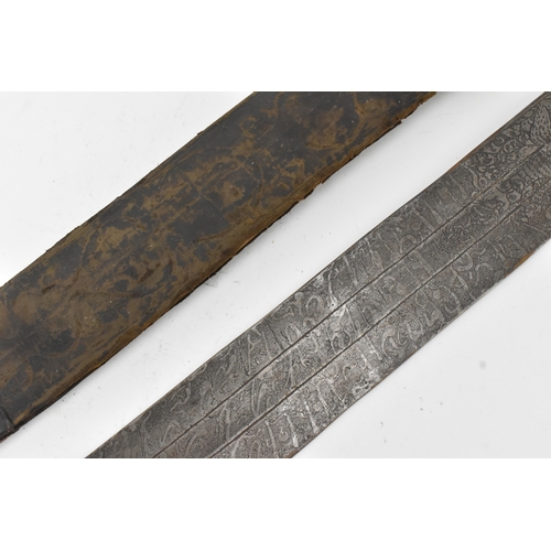 33 - A 19th century Sudanese / North African sword (kaskara type), the broad double-edged steel blade etc... 