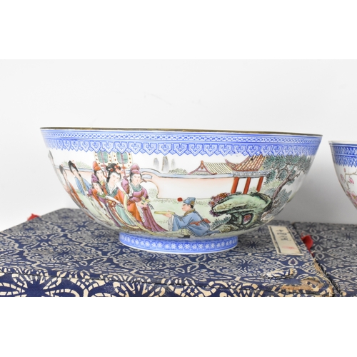34 - A group of five Chinese famille rose egg shell porcelain bowls, with blue enamel borders, decorated ... 