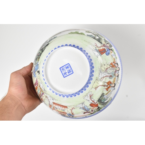 34 - A group of five Chinese famille rose egg shell porcelain bowls, with blue enamel borders, decorated ... 