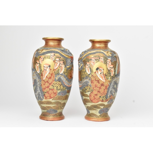 4 - A pair of Japanese Satsuma vases, late Meiji period, decorated in gilt with dragons and figures, aga... 