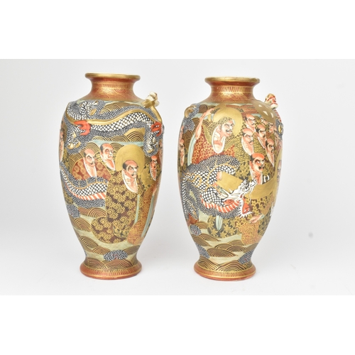 4 - A pair of Japanese Satsuma vases, late Meiji period, decorated in gilt with dragons and figures, aga... 