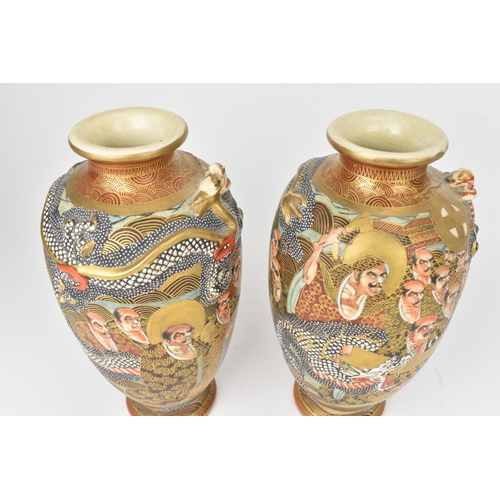 4 - A pair of Japanese Satsuma vases, late Meiji period, decorated in gilt with dragons and figures, aga... 