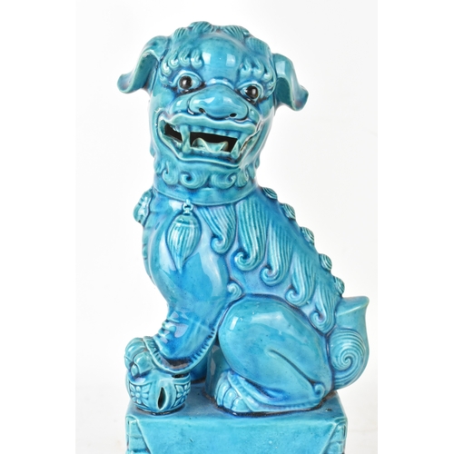 42 - A Chinese turquoise-glazed pottery model of a Foo dog, early/mid 20th century, modelled seated on a ... 