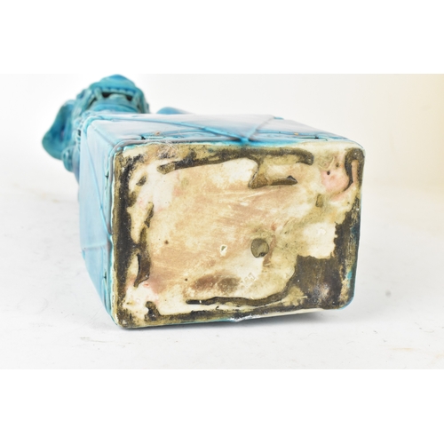 42 - A Chinese turquoise-glazed pottery model of a Foo dog, early/mid 20th century, modelled seated on a ... 
