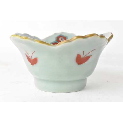 45 - A Japanese porcelain lobed bowl, late Edo/early Meiji period, hand painted with a crane in flight am... 