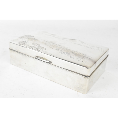46 - A Japanese silver cigarette box, early 20th century, of rectangular form with hinged lid, the cover ... 