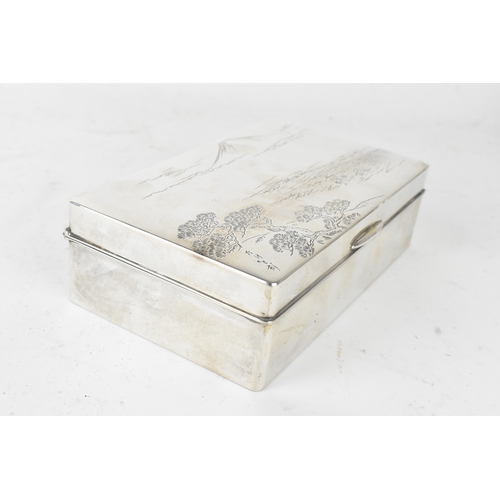 46 - A Japanese silver cigarette box, early 20th century, of rectangular form with hinged lid, the cover ... 