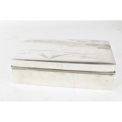 46 - A Japanese silver cigarette box, early 20th century, of rectangular form with hinged lid, the cover ... 