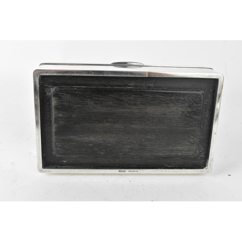 46 - A Japanese silver cigarette box, early 20th century, of rectangular form with hinged lid, the cover ... 