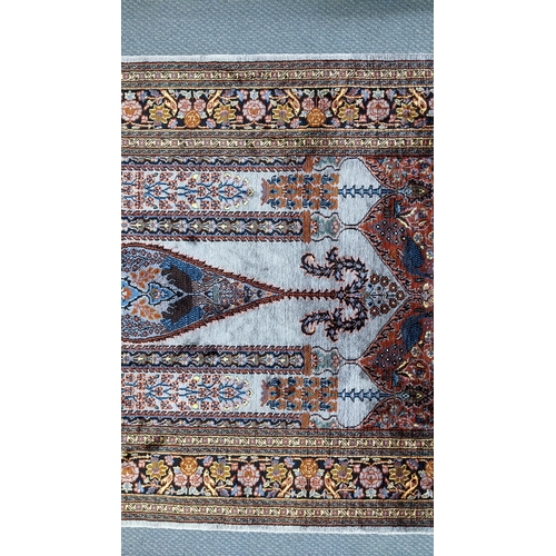48 - A Persian part silk rug, with central mihrab design flanked by flowering columns, stylised vases, tr... 