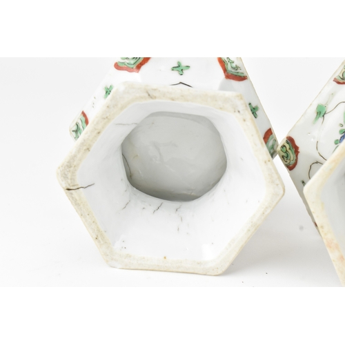 6 - A pair of Chinese famille verte hexagonal salts, Kangxi period (1662–1722), each decorated in enamel... 