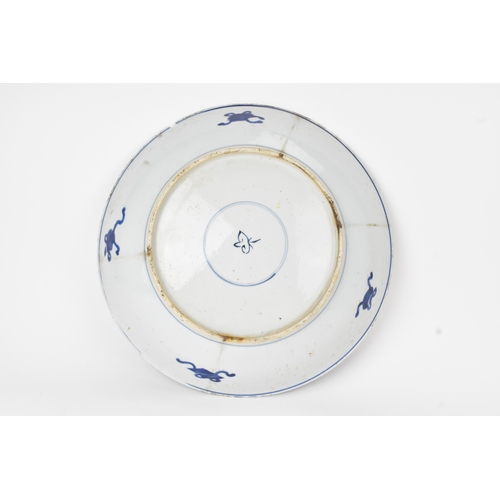 7 - A Chinese blue and white charger, Qing Dynasty, 18th century, painted with two four-clawed dragons s... 