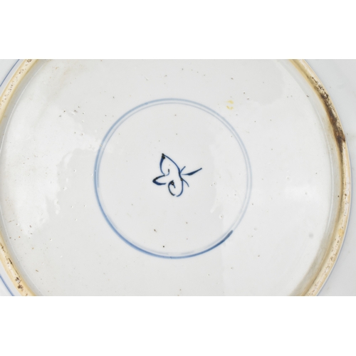 7 - A Chinese blue and white charger, Qing Dynasty, 18th century, painted with two four-clawed dragons s... 