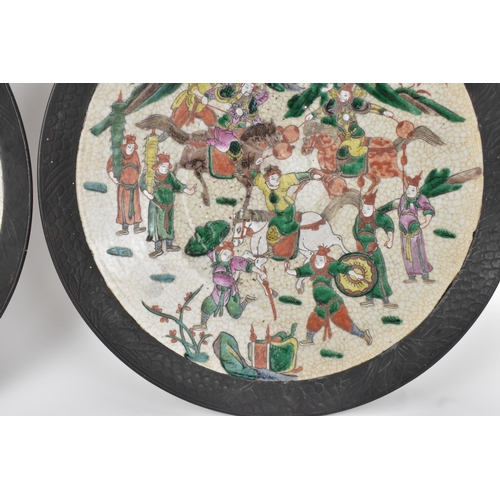 8 - A pair of Chinese famille verte-style crackleware chargers, late Qing dynasty, each painted with war... 