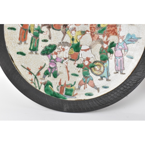 8 - A pair of Chinese famille verte-style crackleware chargers, late Qing dynasty, each painted with war... 