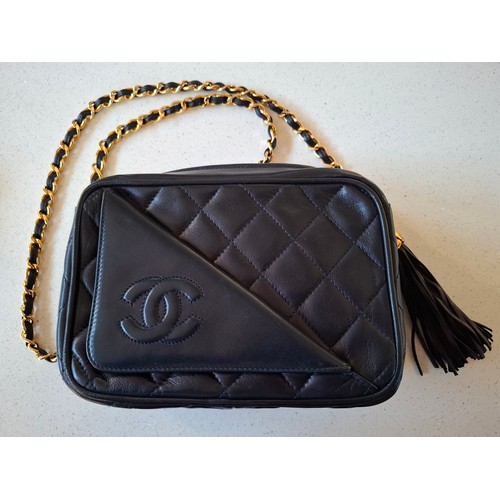 1 - Chanel- A late 1980's/early 1990's navy lambskin leather Matrasse Fringe quilted crossbody bag, 18cm... 