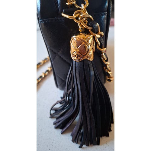 1 - Chanel- A late 1980's/early 1990's navy lambskin leather Matrasse Fringe quilted crossbody bag, 18cm... 