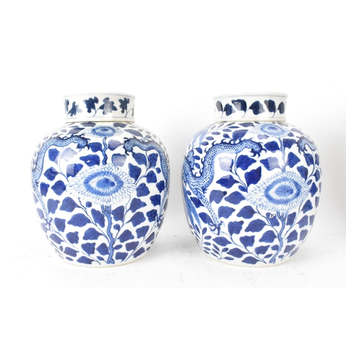 35A - A pair of Chinese blue and white porcelain ginger jars, late Qing dynasty, each of ovoid form with l... 