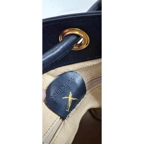 2 - Gucci- A drawstring flora bucket bag having navy leather trim and handles, gold tone hardware, seria... 