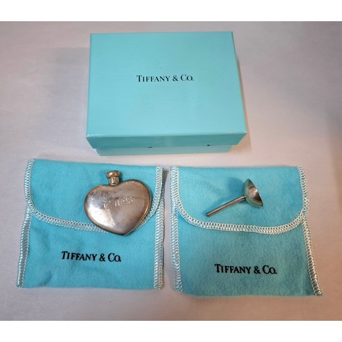12 - Tiffany and Swarovski- A Sterling silver Tiffany & Co heart shaped perfume flask inscribed with the ... 