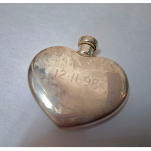 12 - Tiffany and Swarovski- A Sterling silver Tiffany & Co heart shaped perfume flask inscribed with the ... 