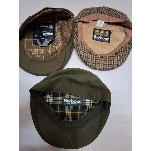 24 - Barbour & Belstaff- A Barbour tweed flat cap size 7⅜, a Barbour green wax cotton flat cap size 7⅝, a... 