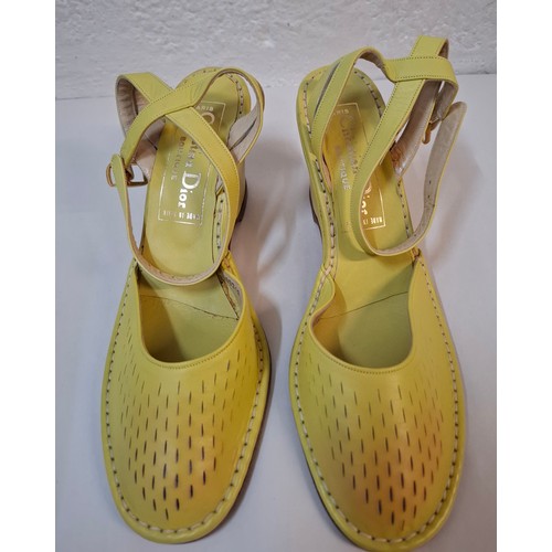 14 - Christian Dior & Versace- A pair of late 20th Century unworn Dior green leather wedge heel sandals s... 
