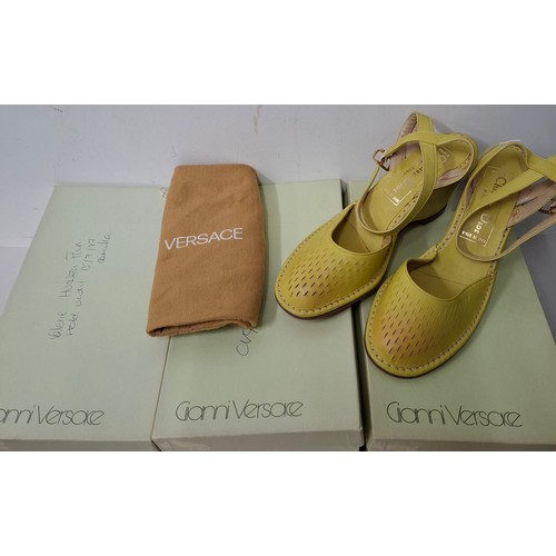 14 - Christian Dior & Versace- A pair of late 20th Century unworn Dior green leather wedge heel sandals s... 