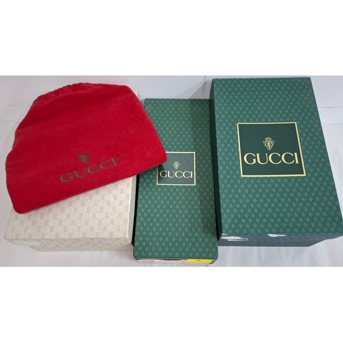 9 - Gucci- A pair of late 20th Century red slippers size 37 (on box) having a red zipped slipper case an... 