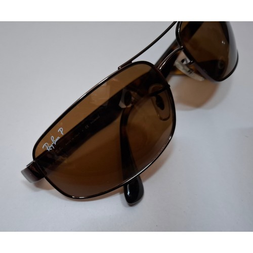61 - Ray Bans- A pair of RB3445 brown metallic framed sunglasses with tortoiseshell effect temples and br... 
