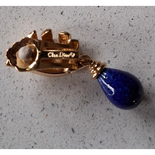 6 - Christian Dior- A gold tone curb link necklace with 4 blue mottled beads, stamped Chr.Dior© to clasp... 