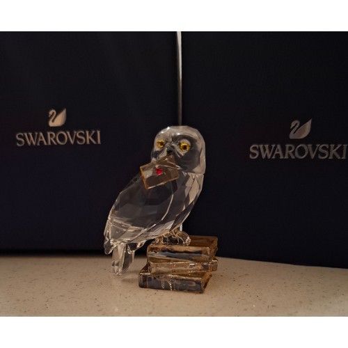 12 - Tiffany and Swarovski- A Sterling silver Tiffany & Co heart shaped perfume flask inscribed with the ... 