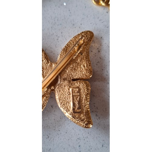 8 - YSL- A late 20th Century gold tone open chain necklace with intermittent faux pearls and aubergine g... 