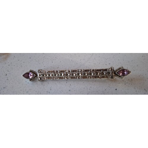 55 - A quantity of silver and silver tone costume jewellery to include an engraved and hinged bangle make... 