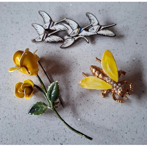 31 - Three enamel brooches to include a mid 20th Century Danish Modernist Erik Magnussen silver and white... 