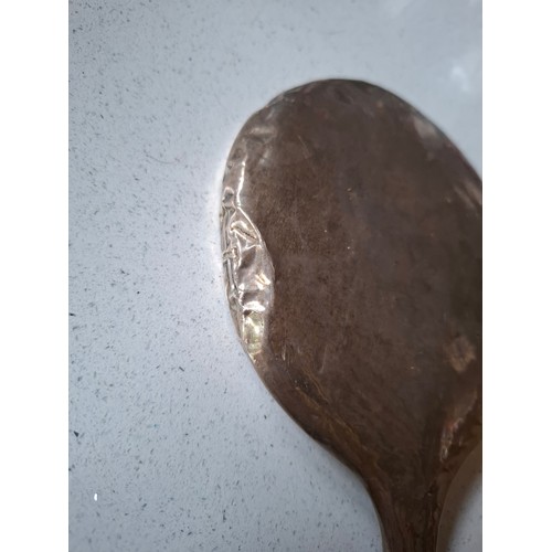 53 - Three matched silver backed dressing table items comprising hand mirror, and 2 brushes, makers mark ... 