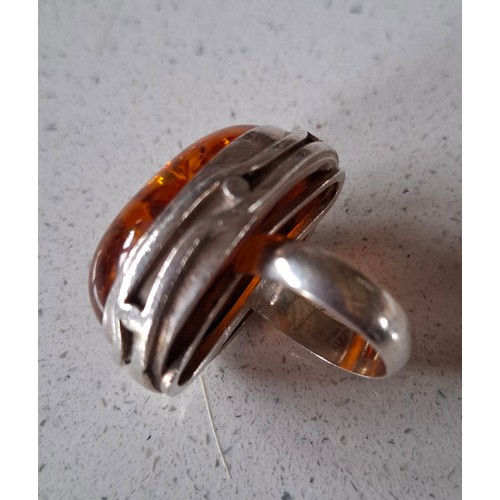 51 - A silver and amber ring. Location:CAB 1
If there is no condition report, please request
