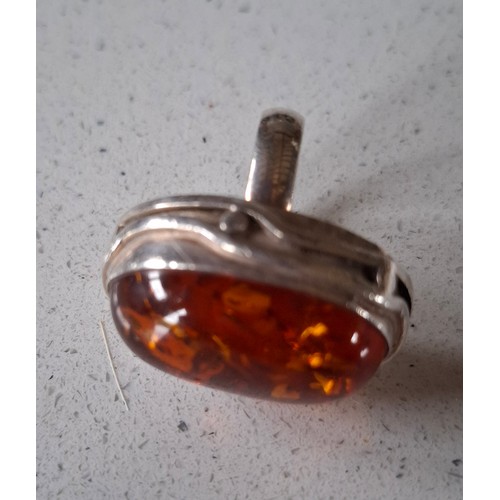51 - A silver and amber ring. Location:CAB 1
If there is no condition report, please request