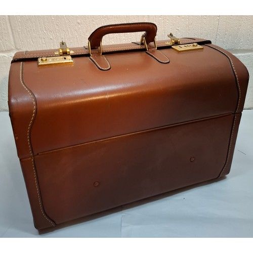 27 - Dunhill- A vintage tan leather Gladstone bag having gold tone hardware, removable tray and cream wat... 
