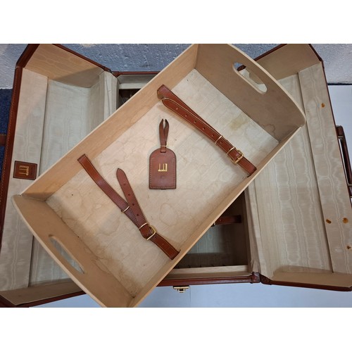 27 - Dunhill- A vintage tan leather Gladstone bag having gold tone hardware, removable tray and cream wat... 