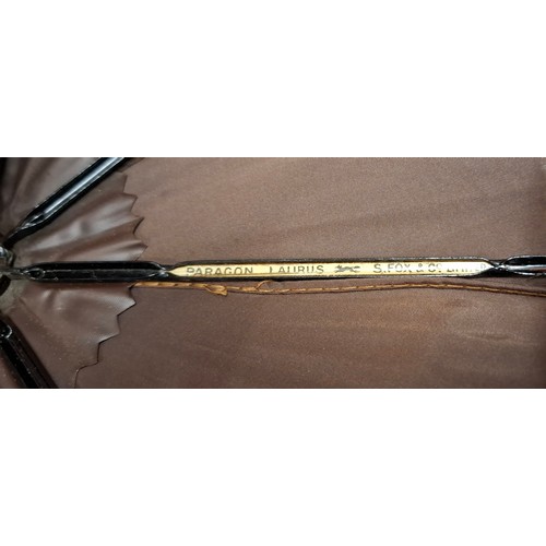 44 - A vintage S.Fox & Co Paragon Laurus brown umbrella having a treen cane effect handle terminating in ... 