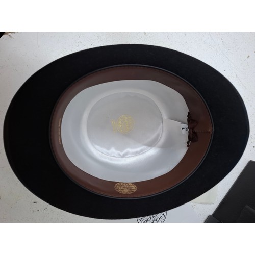 45 - A Lock & Co black felt bowler hat, size L/59/7¼ having a silver tone Lock & Co hat pin to one side w... 