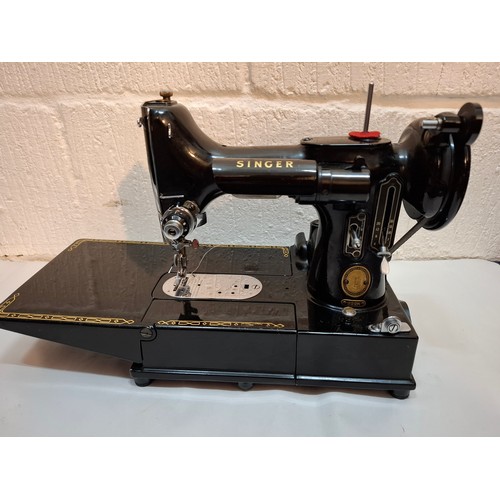 46 - A 1957 Singer Feather weight 222K electric sewing machine serial no:EM957054 with case and accessori... 