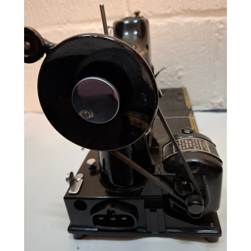 46 - A 1957 Singer Feather weight 222K electric sewing machine serial no:EM957054 with case and accessori... 