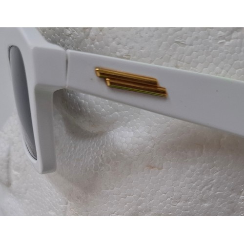 16 - Bottega Veneta- A pair of white rectangular sunglasses BV1213S having a branded green case. Location... 