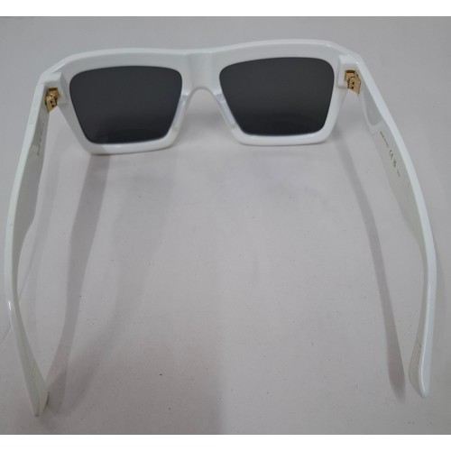 16 - Bottega Veneta- A pair of white rectangular sunglasses BV1213S having a branded green case. Location... 